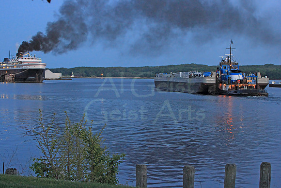 2012-05-16-0054 Tug and Barge Spartan Passes Docked Badger