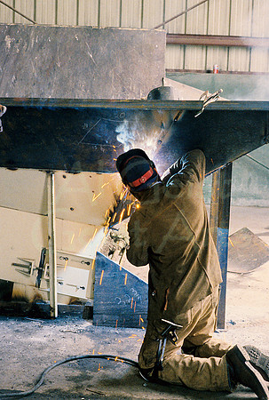 AK107-Welder Fabricating Mining Equipment